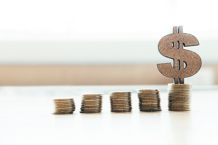 Coins and dollar icon on the table