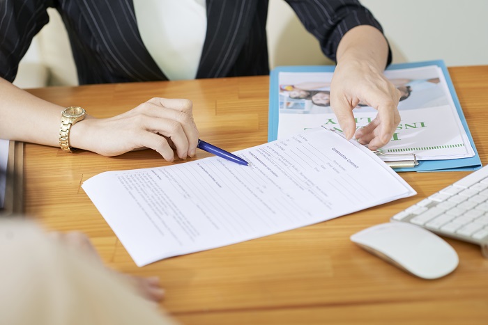 Woman showing what to write in divorce form